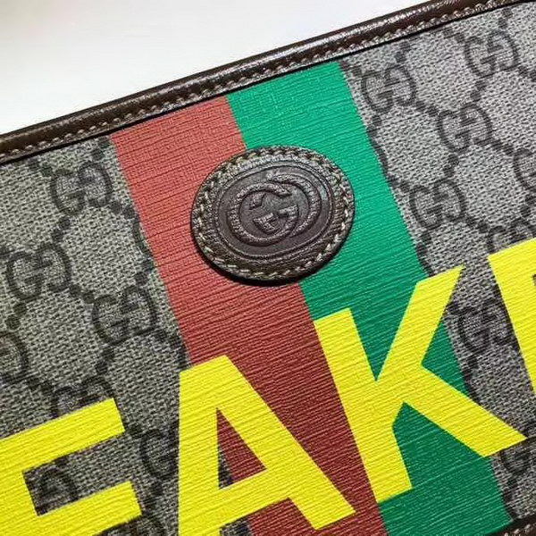 【原版皮】古驰/Gucci 印花手拿包，经典GG Supreme高级人造帆布匠心制成，点缀Fake和Not词语印花，在品牌标志性元素中注入诙谐意味，款号：636243